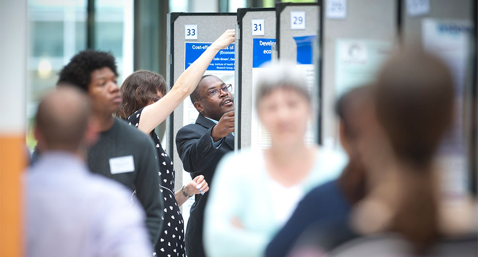 Crowds looking at showcase display boards