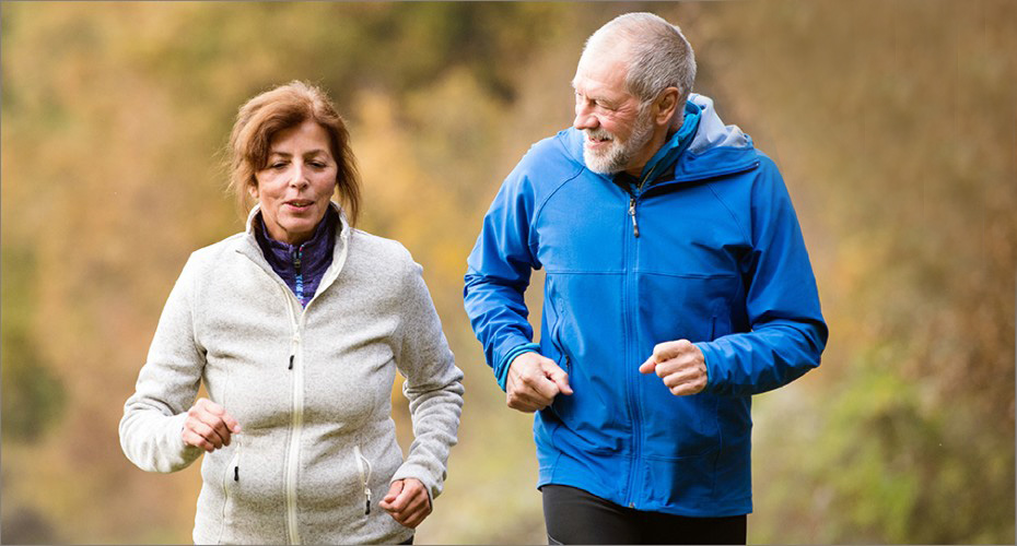 An older couple running together