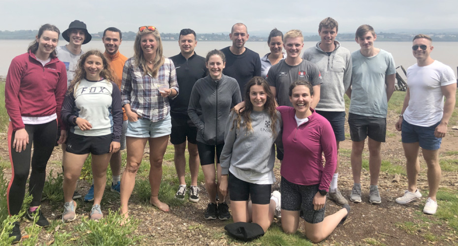 Group photos of the Nutritional Physiology research group, standing by the sea shore