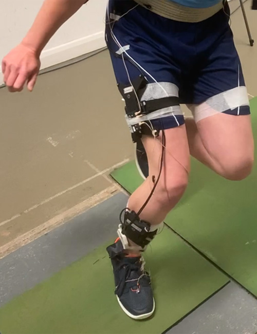 Close up of a person's legs running on pressure plates, to measure how their feet are functioning