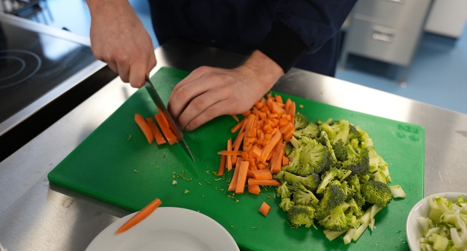 Chopping carrots and broccoli